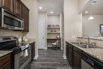 Slab granite kitchen countertops with mosaic backsplash